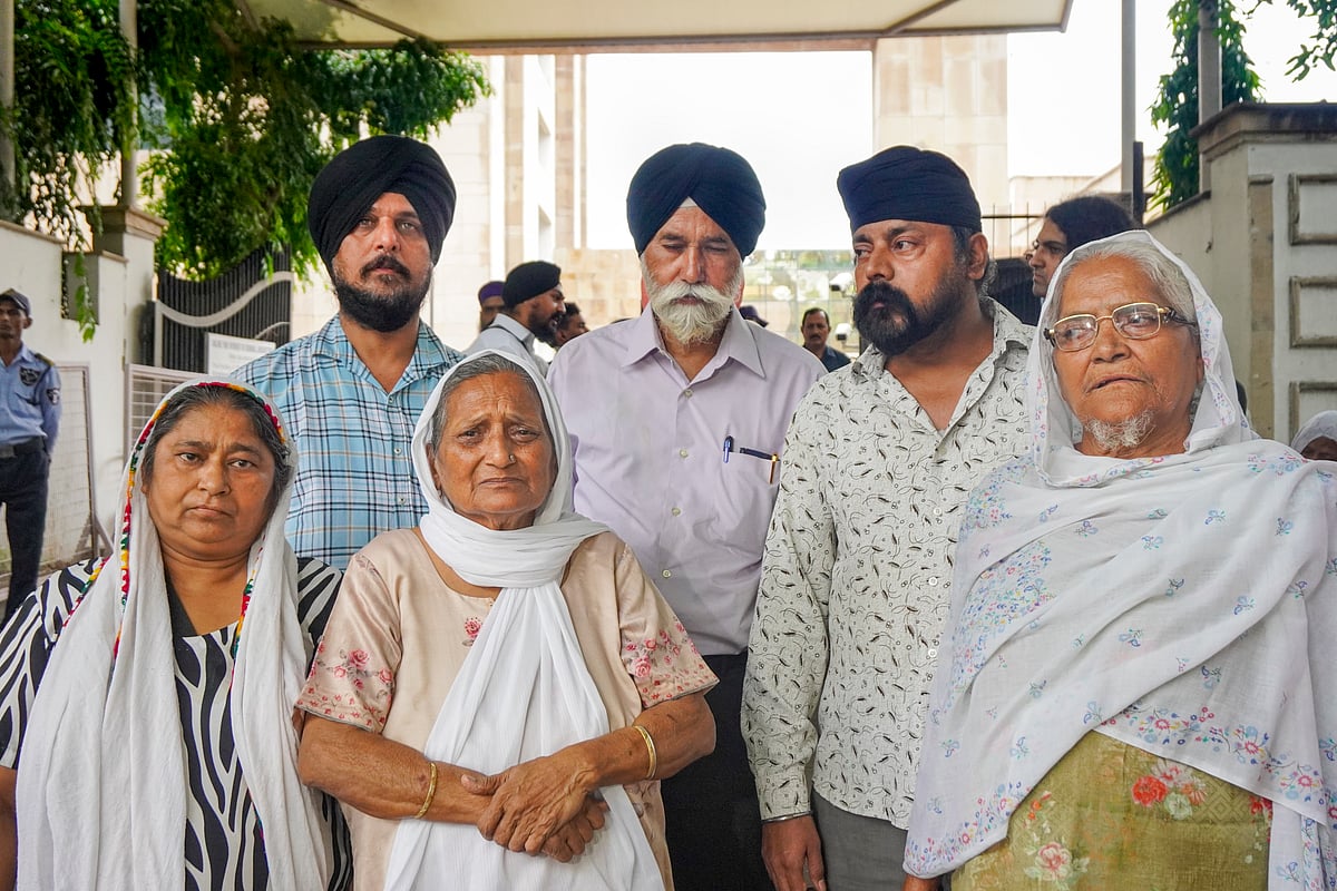 PTI : Family members of anti-Sikh riots' victim after Tytler's hearing | 